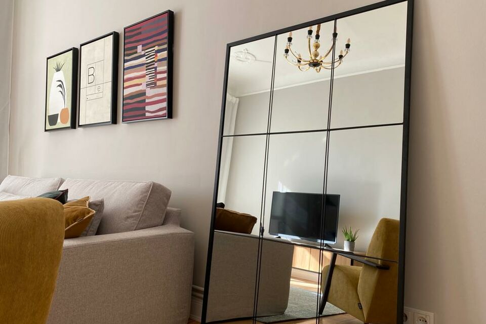 Furnished apartment, living room with mirror feature in Berlin Charlottenburg