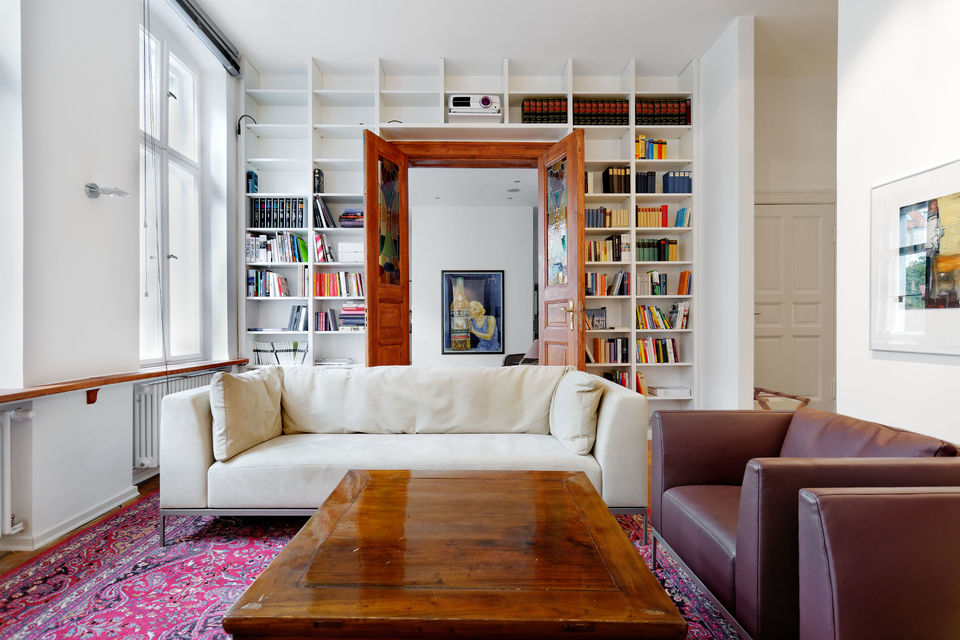 Furnished apartment, living room with built-in bookshelves in Berlin Charlottenburg