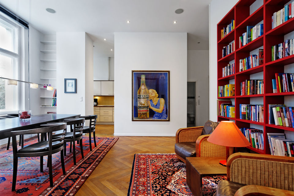 Furnished apartment, living room with red bookshelves in Berlin Charlottenburg