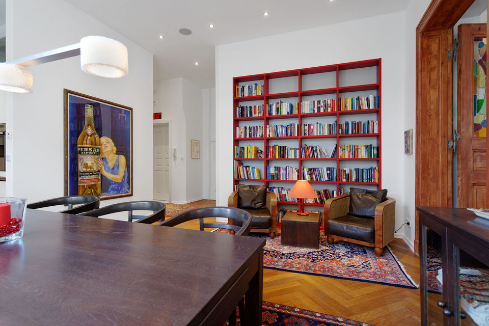 Furnished apartment, living room with red bookshelf in Berlin Charlottenburg