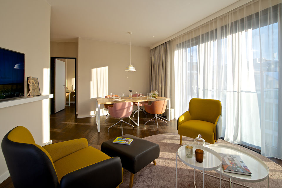 Serviced apartment, living room with panoramic windows in Berlin Mitte
