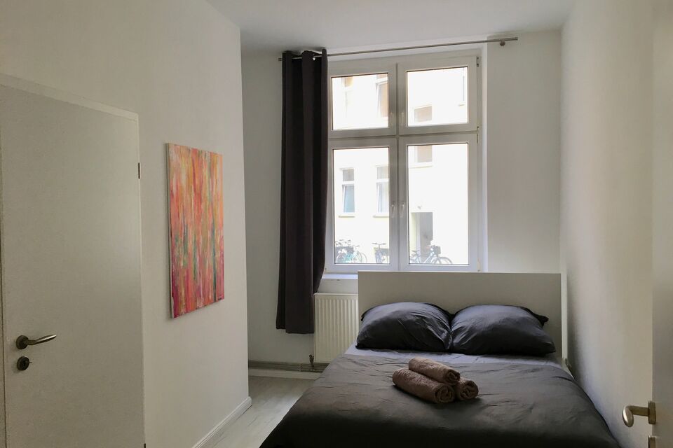 Furnished apartment, bedroom with large windows in Berlin Friedrichshain