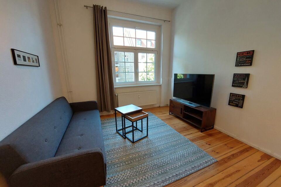 Furnished apartment, living room with wooden flooring in Berlin Neukölln