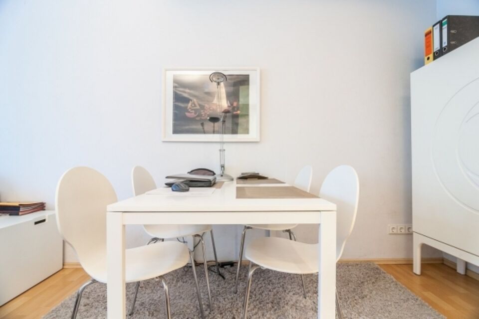 Furnished apartment, dining room with white dining table in Berlin Wilmersdorf