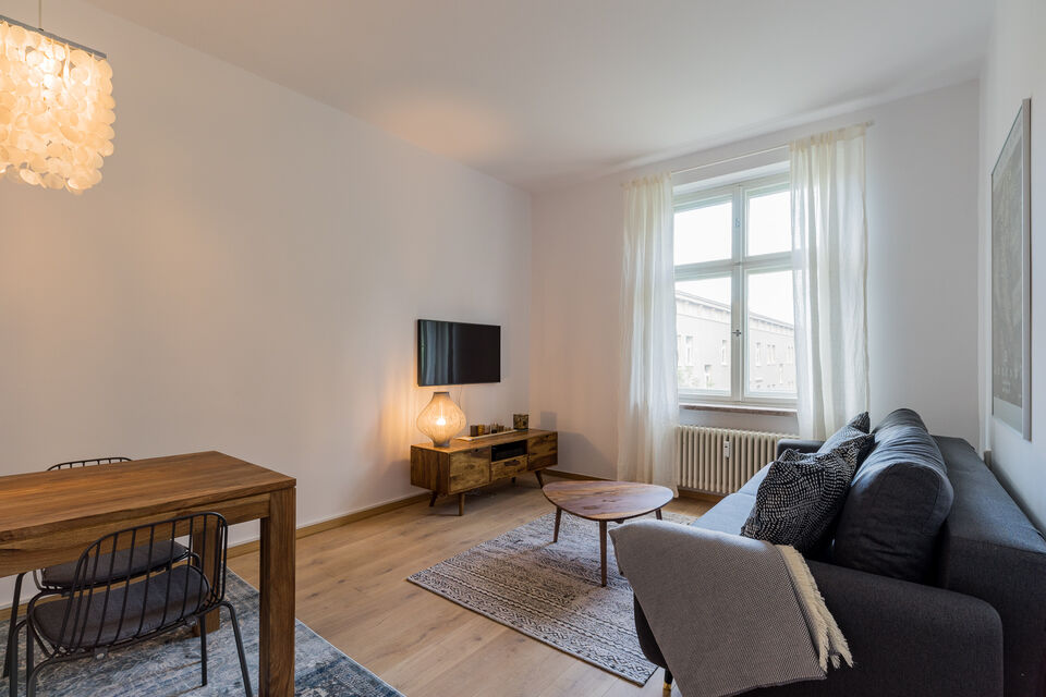 Furnished apartment, living room with wooden furniture in Berlin Friedrichshain
