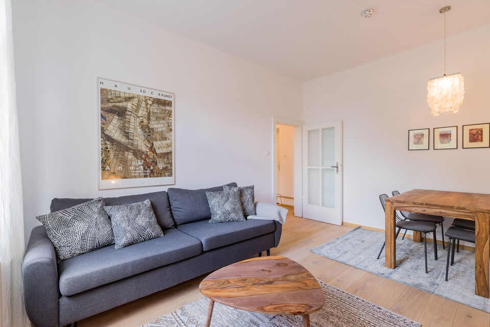 Furnished apartment, living room with gray sofa in Berlin Friedrichshain