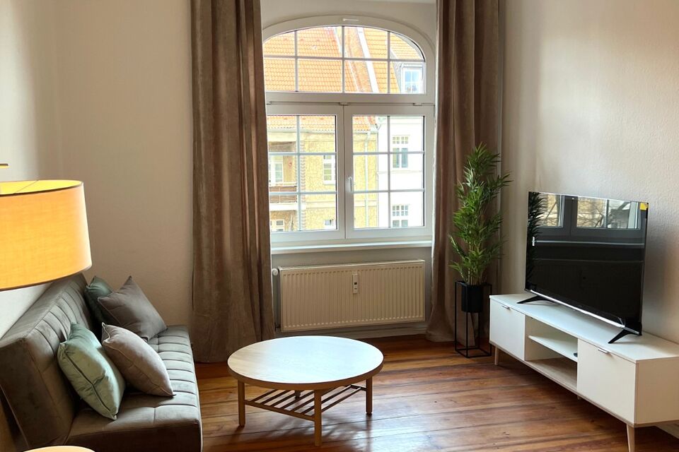 Furnished apartment, living room with period windows in Berlin Neukölln