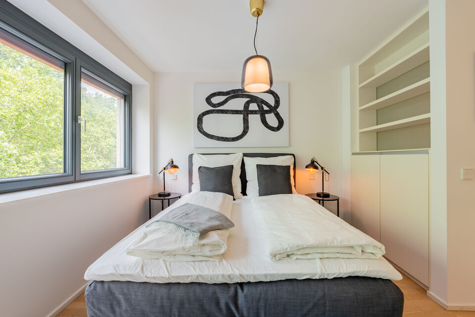 Furnished apartment, bedroom 1 with designer pendant light in Berlin Kreuzberg