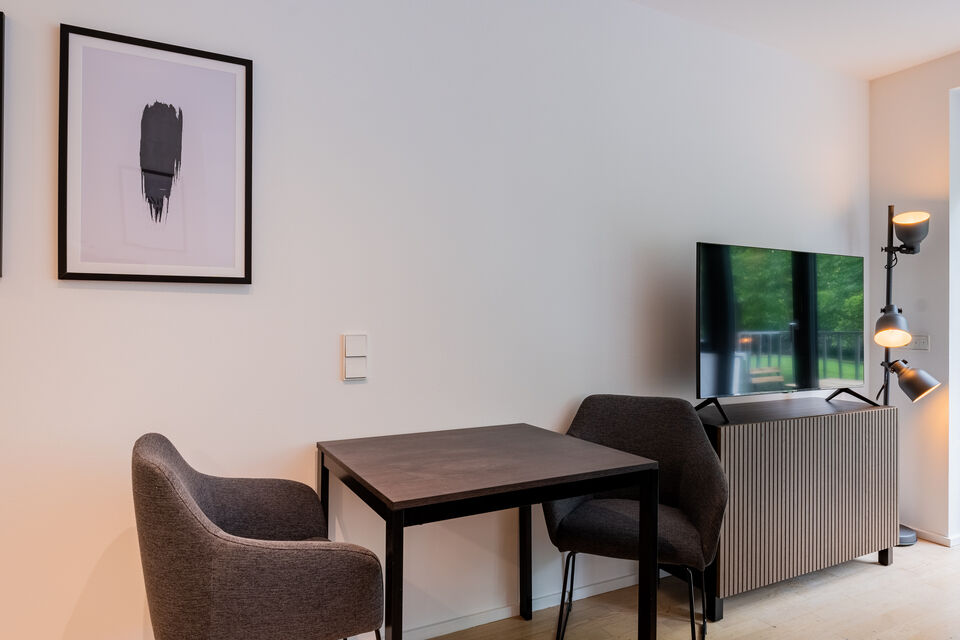 Furnished apartment, living room with modern dining table in Berlin Kreuzberg