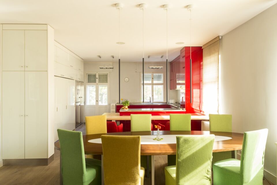 Furnished apartment, dining room with colorful chairs in Berlin Dahlem