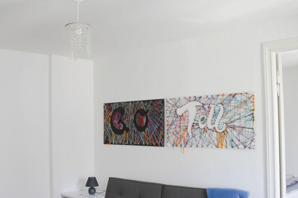 Furnished apartment, living room with contemporary wall art in Berlin Neukölln