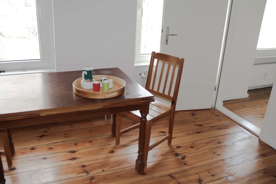 Furnished apartment, dining room with wooden floorboards in Berlin Neukölln