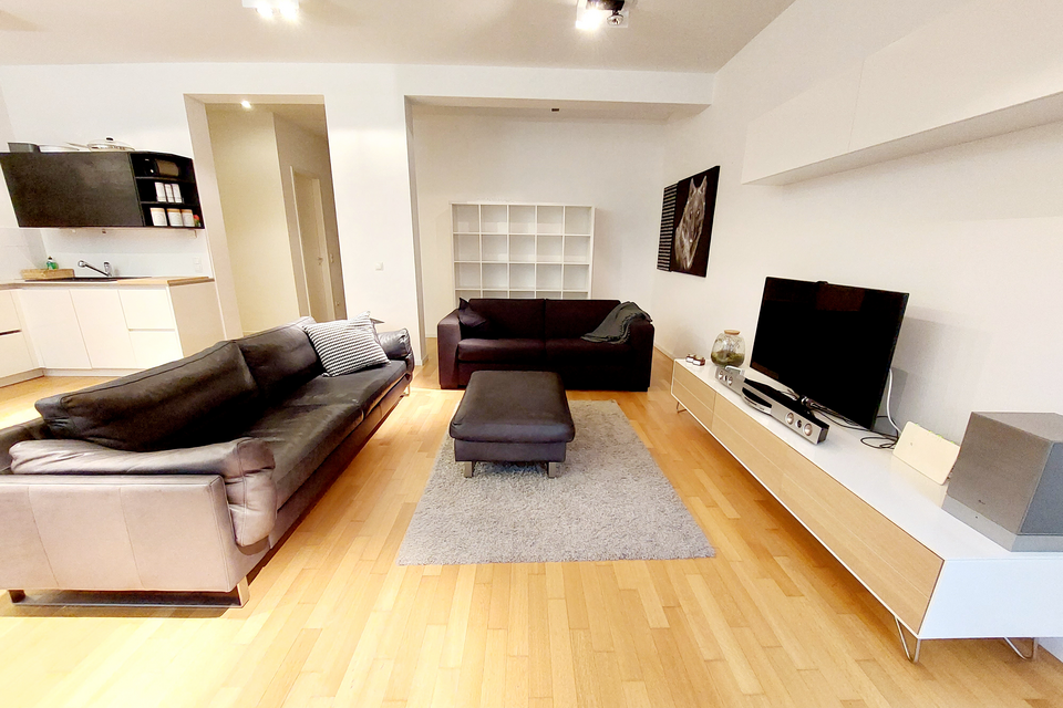 Furnished apartment, living room with leather sofa in Berlin Mitte