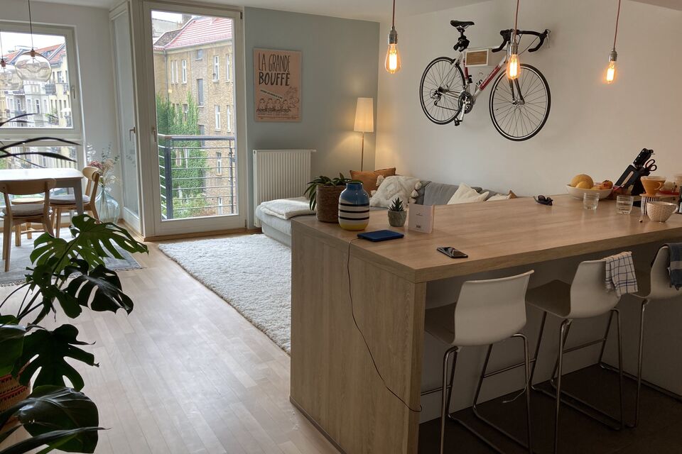 Furnished apartment, living room with bicycle wall decoration in Berlin Mitte