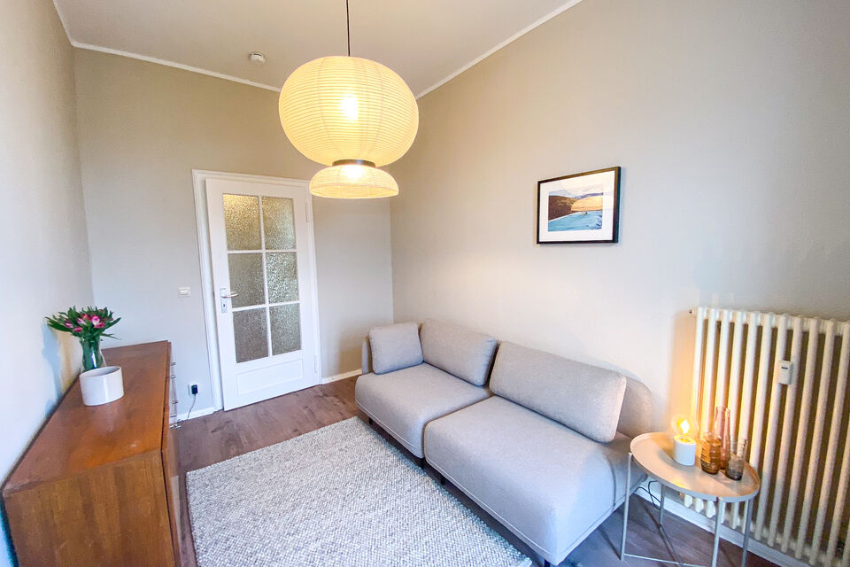 Furnished apartment, living room with pendant lamp in Berlin Friedrichshain