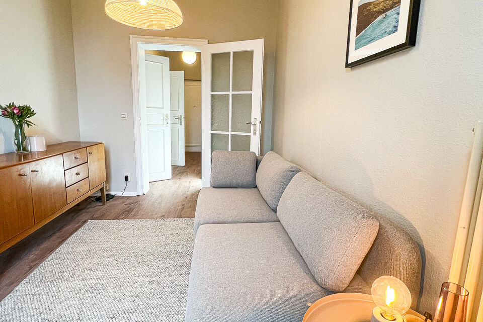 Furnished apartment, living room with designer sofa in Berlin Friedrichshain