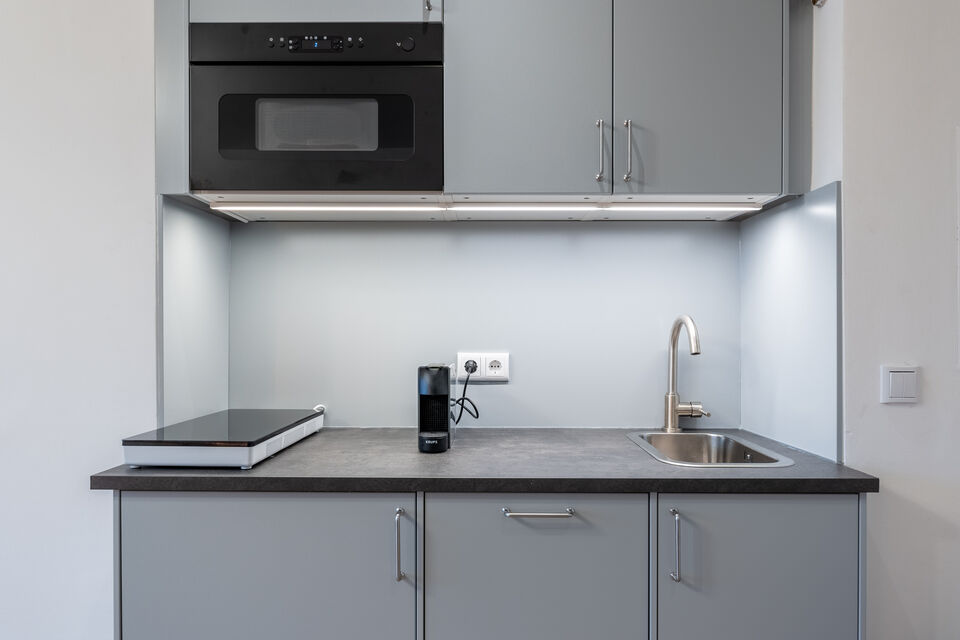 Furnished apartment, kitchen with cooking niche and granite countertop in Berlin Charlottenburg