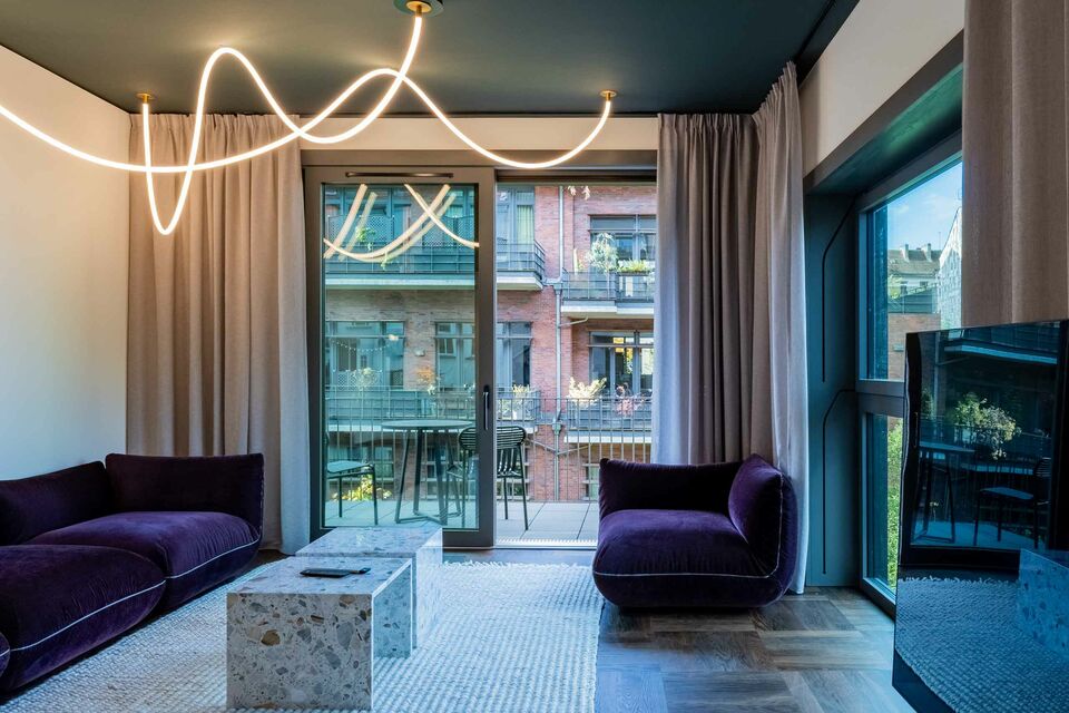 Furnished apartment, living room with designer neon lighting in Berlin Prenzlauer Berg