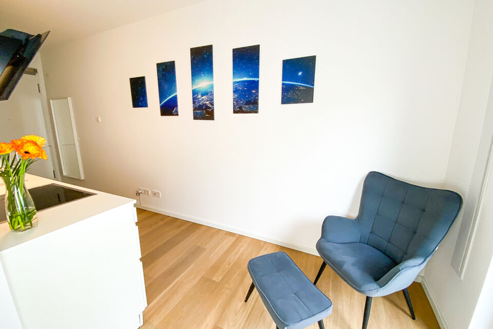 Furnished apartment, living room with designer armchair in Berlin Friedrichshain