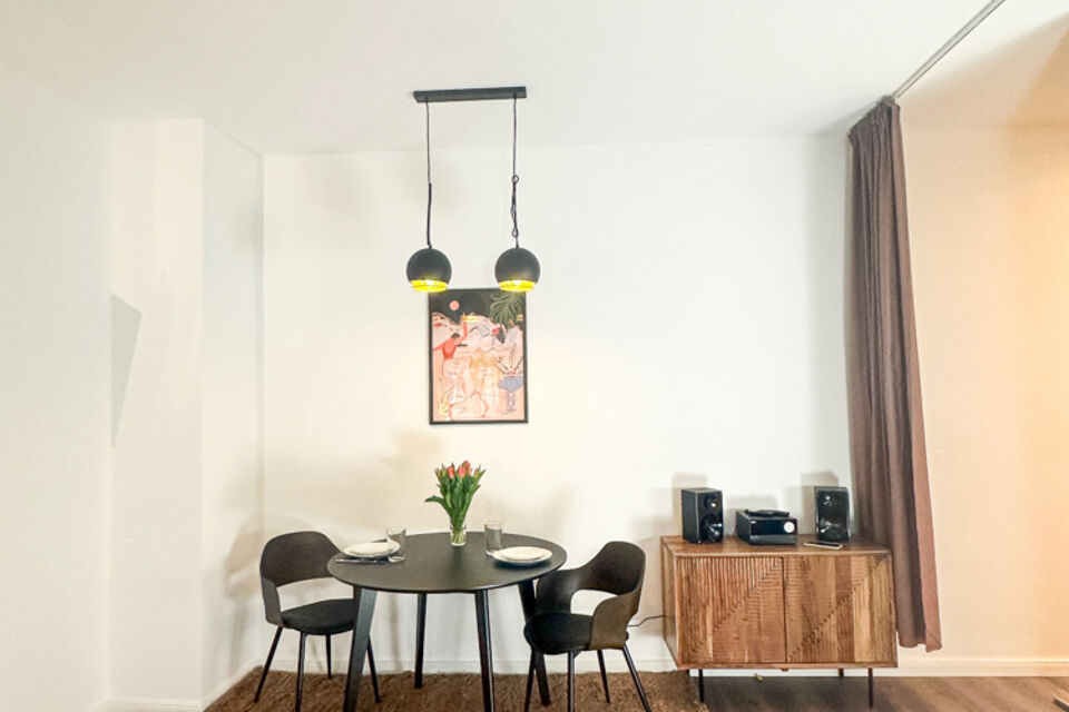 Furnished apartment, dining room with designer pendant light in Berlin Pankow