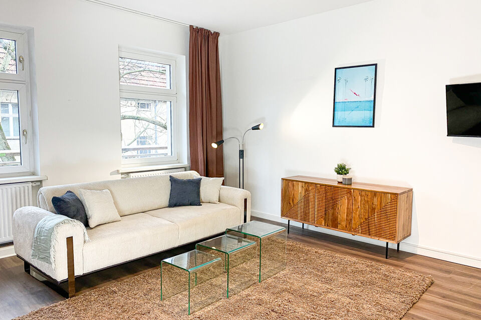 Furnished apartment, living room with wooden sideboard in Berlin Pankow