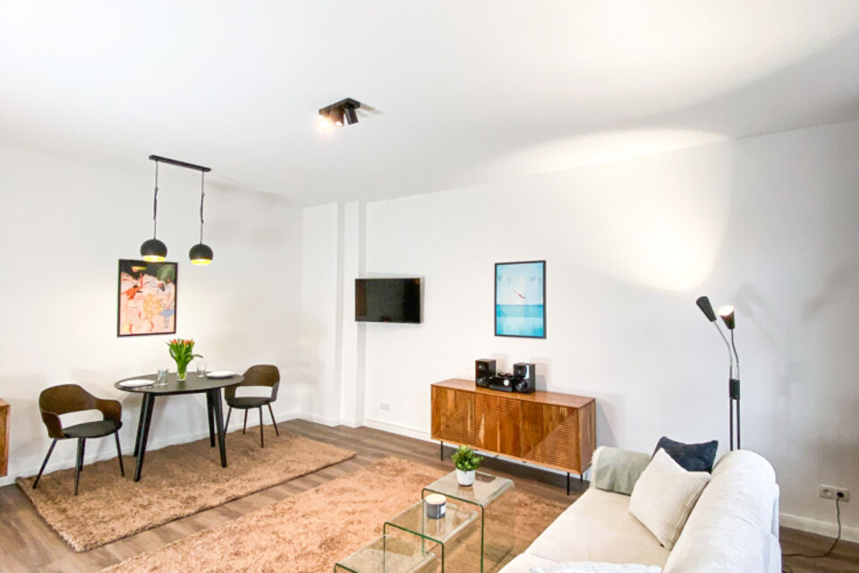 Furnished apartment, living room with wooden sideboard in Berlin Pankow