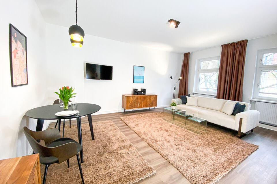 Furnished apartment, living room with natural wood flooring in Berlin Pankow