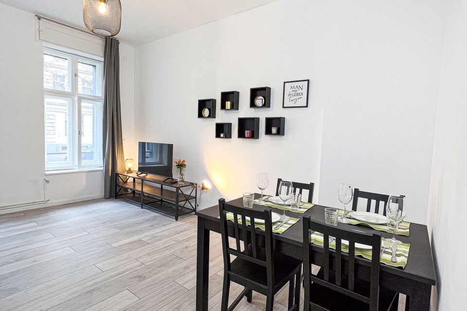 Furnished apartment, dining room with black dining table in Berlin Friedrichshain