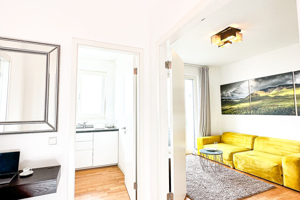 Furnished apartment, living room with yellow sofa in Berlin Tiergarten