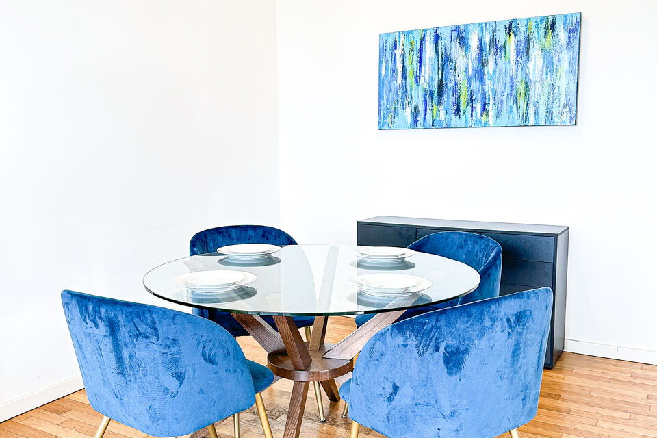 Furnished apartment, dining room with blue velvet chair in Berlin Tiergarten