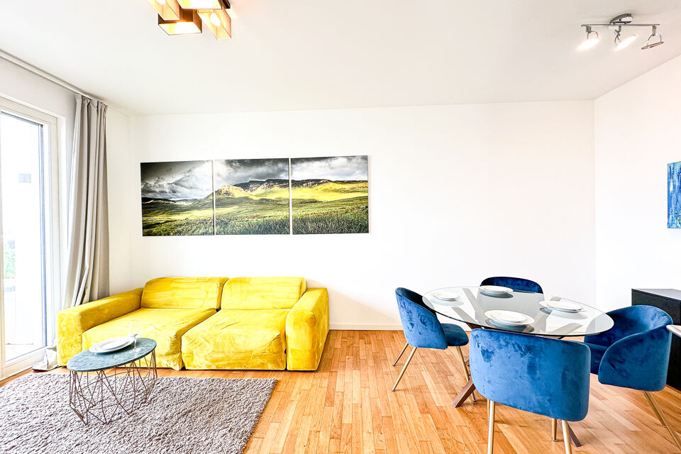 Furnished apartment, living room with yellow sofa in Berlin Tiergarten