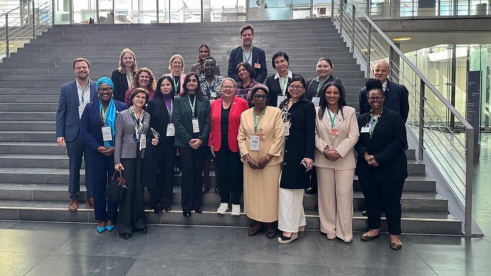 A group standing on stairs 