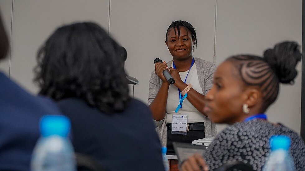 A woman giving a speech