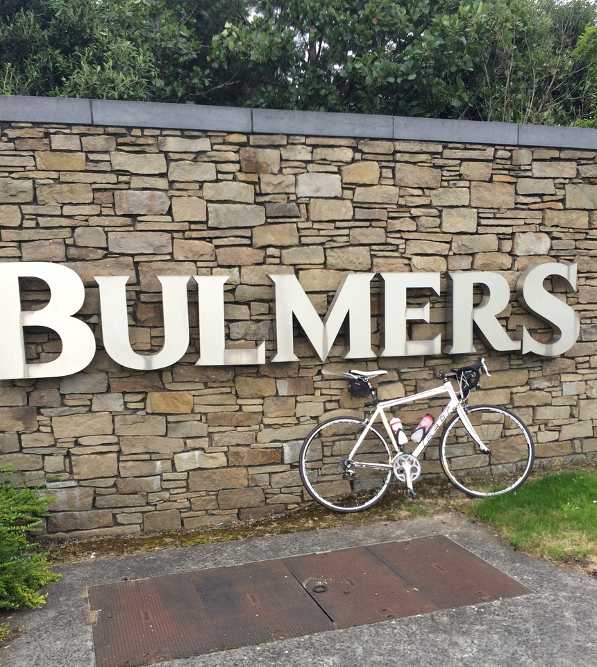 John's bike beneath the Bulmers factory sign