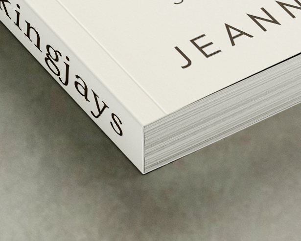 Close-up of a catalogue corner showing perfect binding with glued spine and flexible cover.