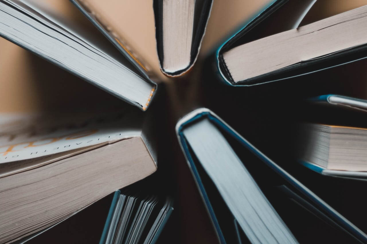 An aerial view of hardcover books and paperback books