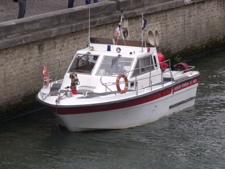 Small Firemen boat on the river Seine, Paris