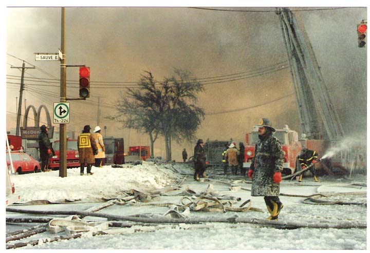 Icy photo of Montreal Fire fighters at work