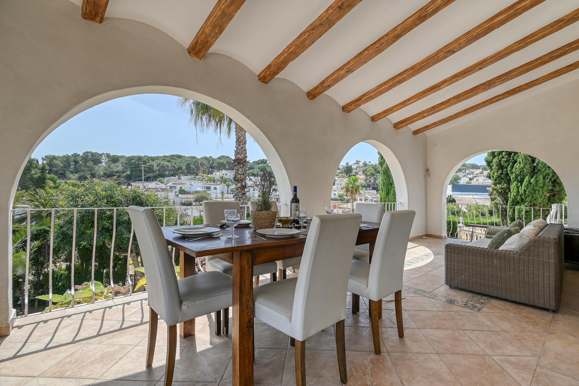 Outdoor terrace and garden at Calma Marina in Spain