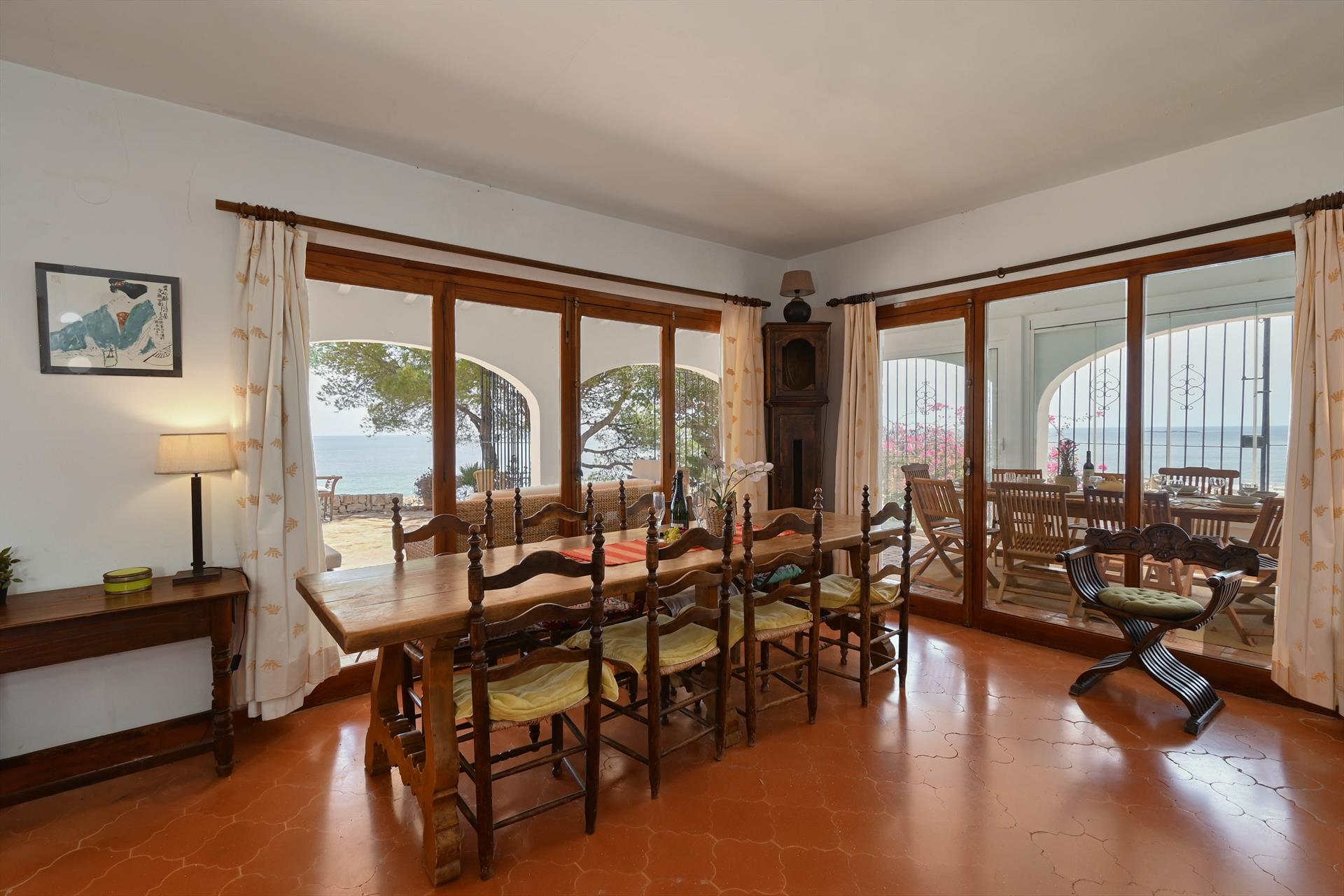 Outdoor terrace and garden at Casa Timeris 8 pax in Spain