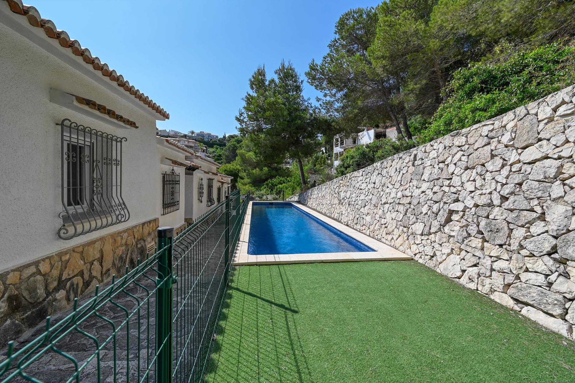 Swimming pool area near Las Gaviotas III in Spain