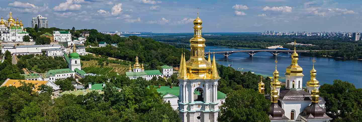 Aerial drone view of kiev pechersk lavra churches on hills from above, cityscape of kyiv city, ukraine