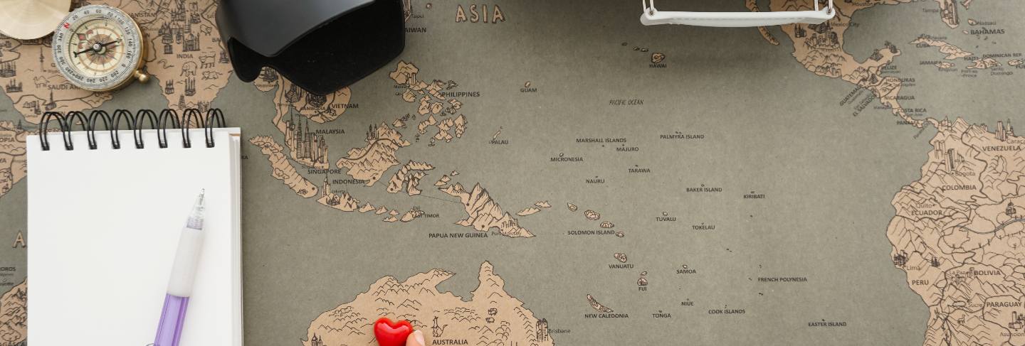 Travel background with hand placing a heart in australia