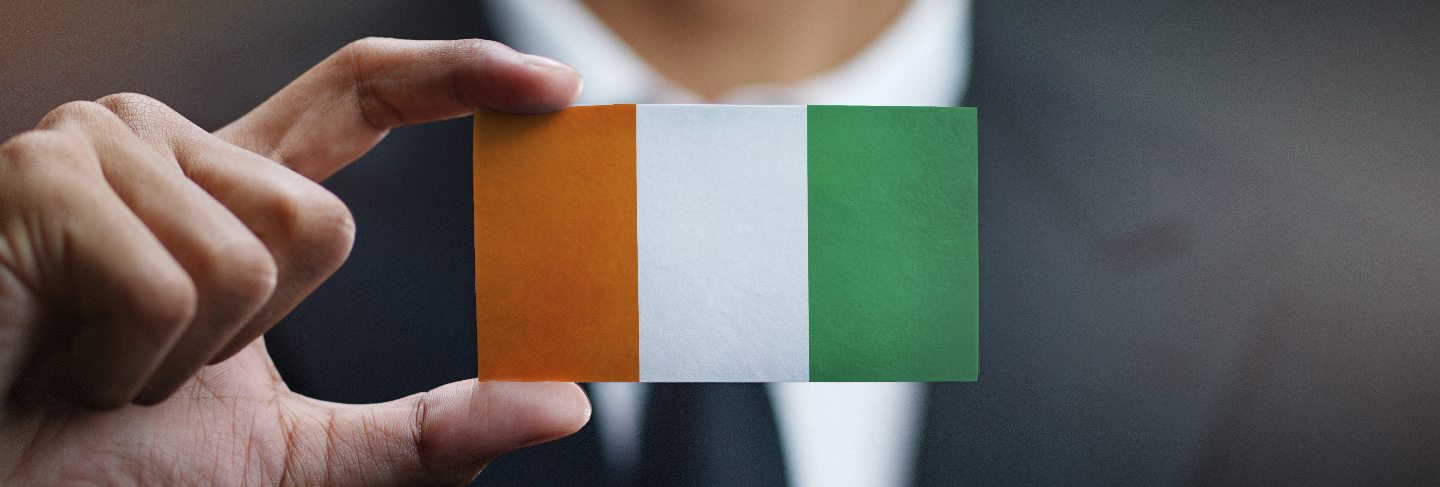 Businessman holding card of ivory coast flag