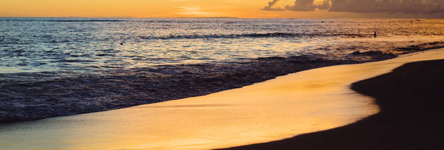 Sunset on the ocean. beautiful bright sky, reflection in water, waves.
