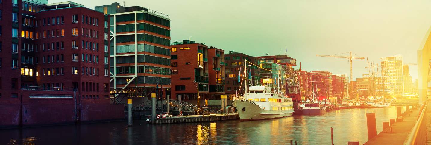 Beautiful picture of sunset in port city with water, ships and bridge. toning. hamburg, germany.