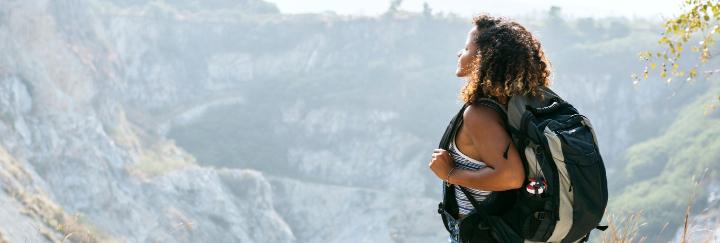 Woman traveler looking at mountain