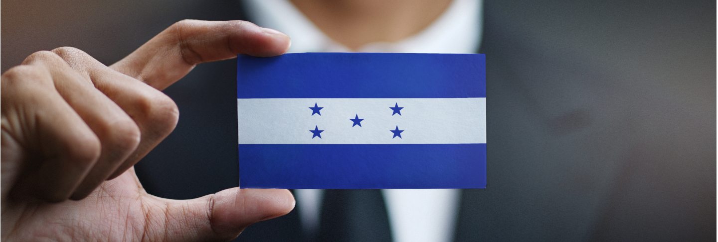 Businessman holding card of honduras flag