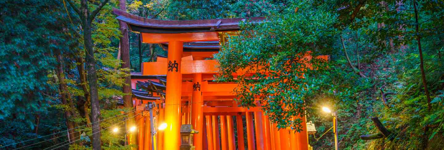Red tori gate at fushimi inari shrine temple in kyoto, japan