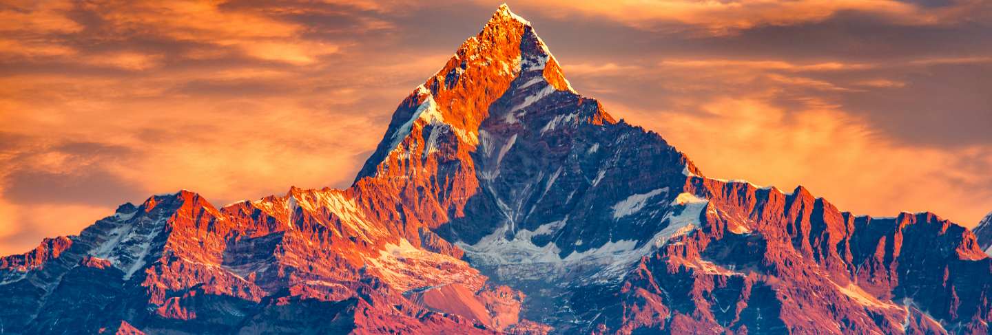 Beautiful cloudy sunrise in the mountains with snow ridge from himalaya view point, pokhara nepal